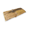 Fragment of a woven straw mat with frayed edges on a white background